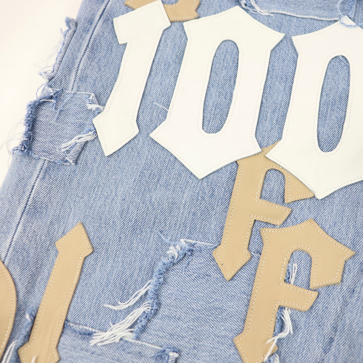 DFFRNT 100RY letters blue shorts