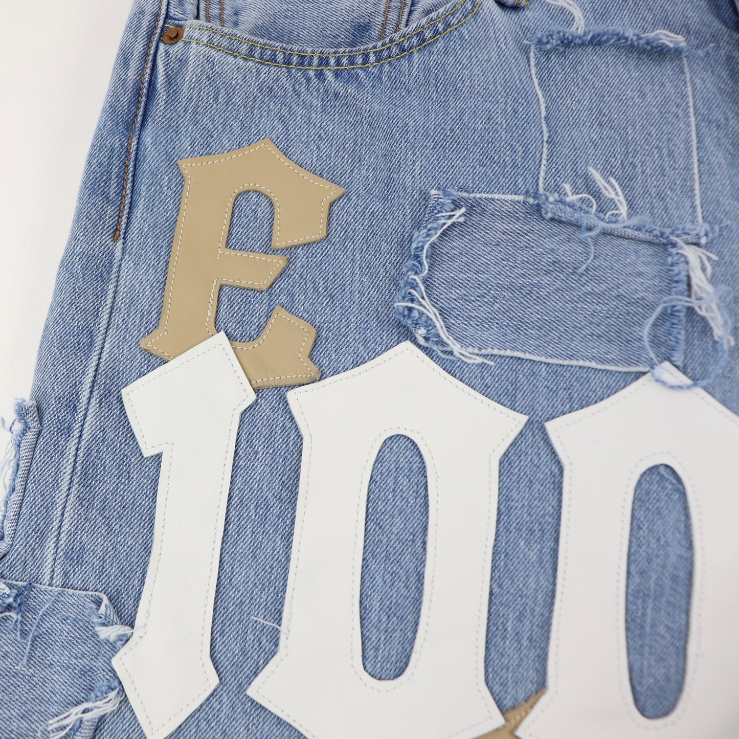 DFFRNT 100RY letters blue shorts